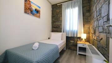 Apartment, 2 Bedrooms, Patio, Beach View | In-room safe, soundproofing, iron/ironing board, free WiFi