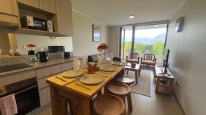 Apartment | Private kitchen - Oceana Suites Meli Pucón (Pucon)