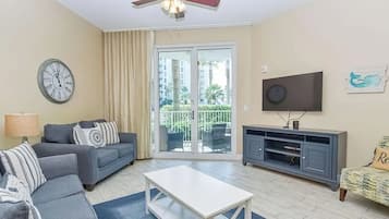 Signature Condo, 2 Bedrooms, Balcony, Pool View | Living room | 40-inch Smart TV with cable channels