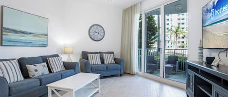Signature Condo, 2 Bedrooms, Balcony, Pool View | Living room | 40-inch Smart TV with cable channels