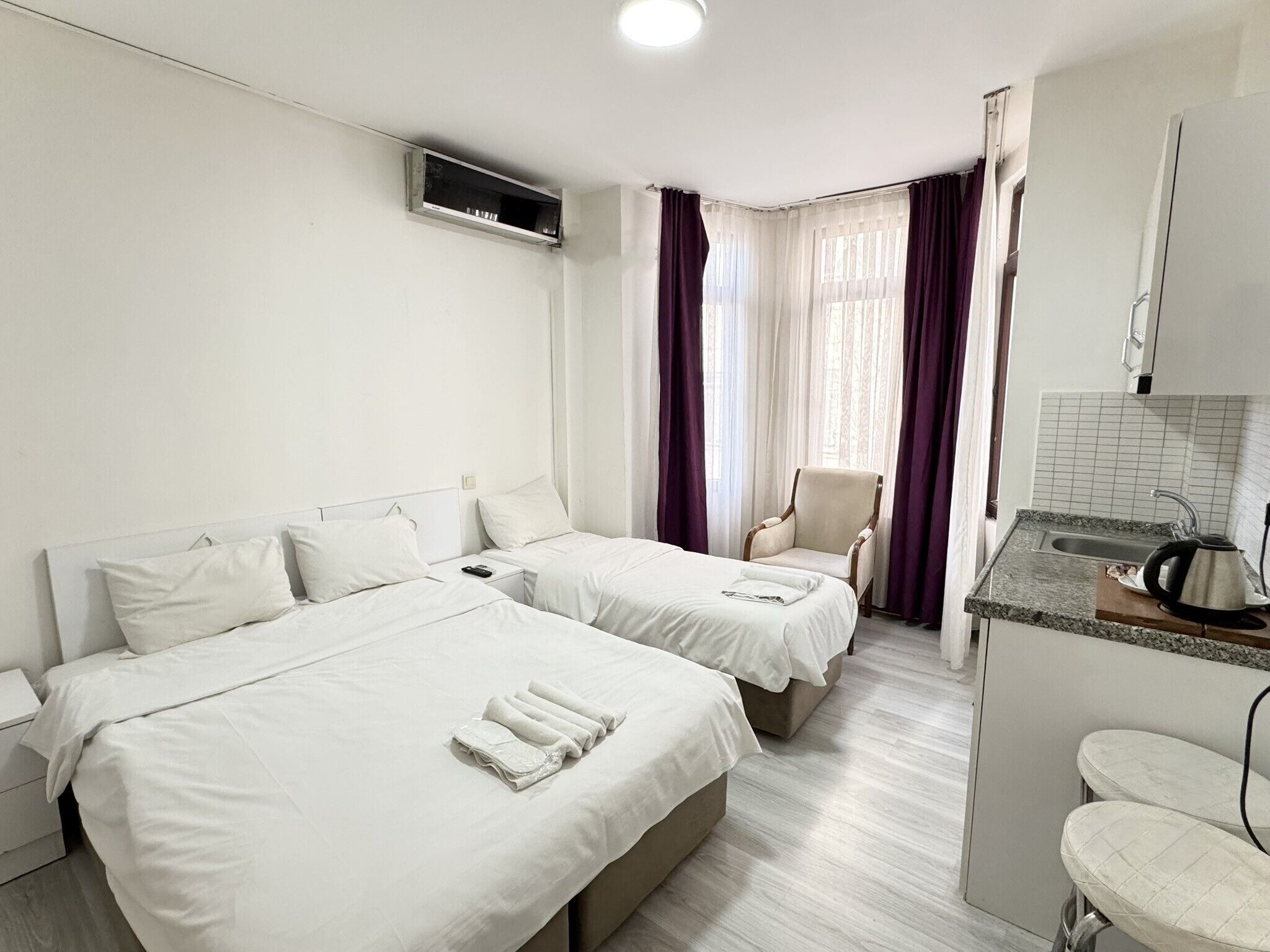 Triple Room, City View | Desk, iron/ironing board, free WiFi, bed sheets