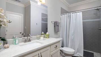 Shower, hair dryer, towels, shampoo
