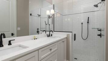 Shower, hair dryer, towels, shampoo