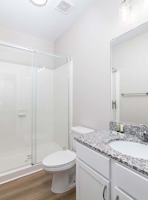 Shower, hair dryer, towels, shampoo