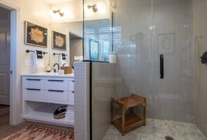 Shower, hair dryer, towels, shampoo