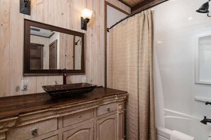 Shower, hair dryer, towels, shampoo