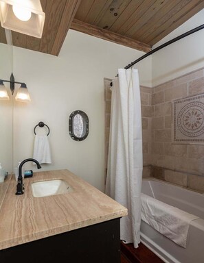 Shower, hair dryer, towels, shampoo