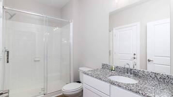 Shower, hair dryer, towels, shampoo