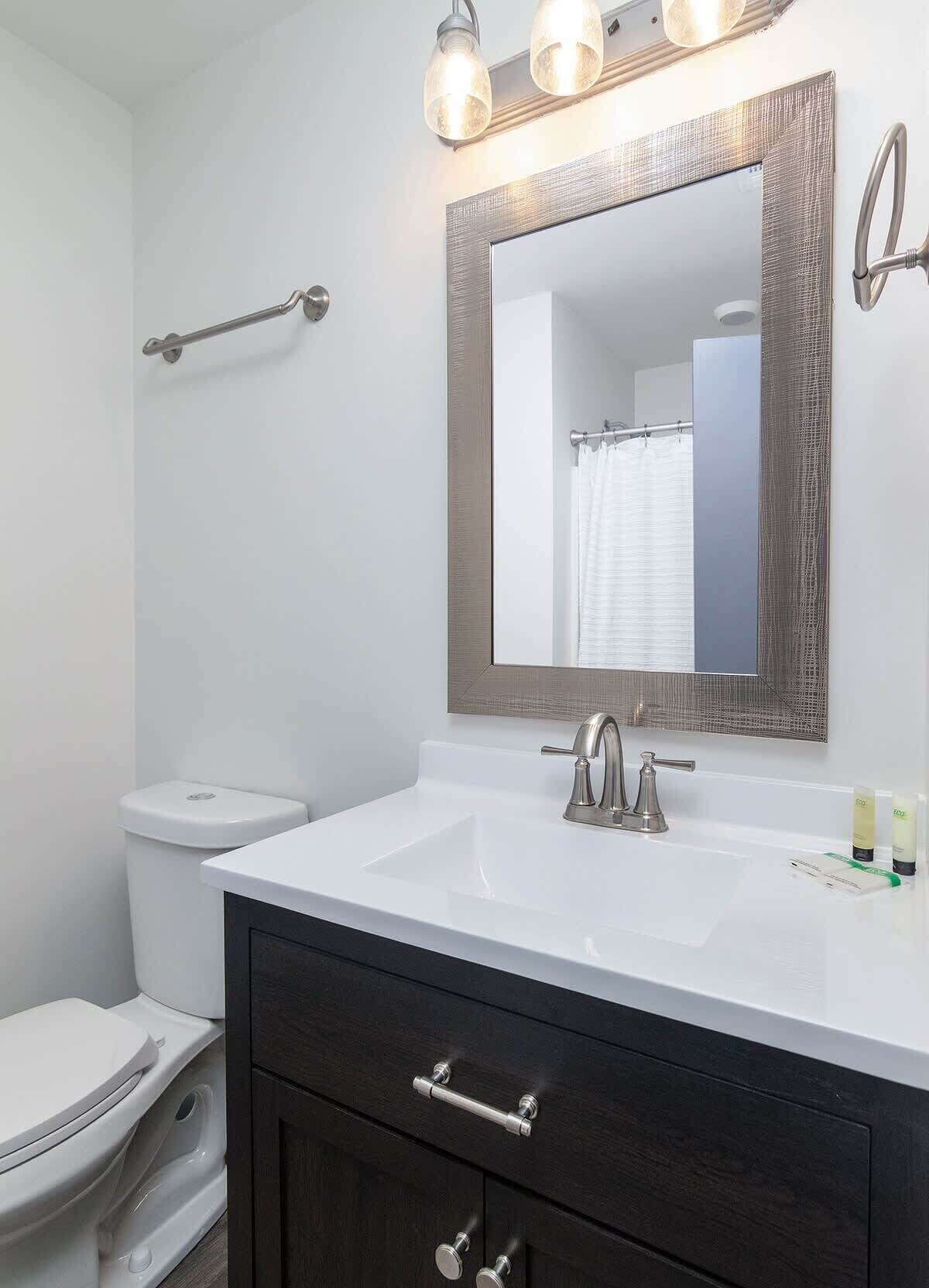 Shower, hair dryer, towels, shampoo