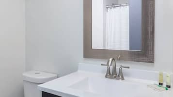 Shower, hair dryer, towels, shampoo
