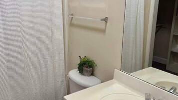 Shower, hair dryer, towels, shampoo
