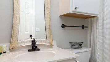 Shower, hair dryer, towels, shampoo