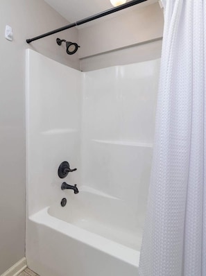 Shower, hair dryer, towels, shampoo