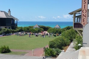 A coastal hotel with a grassy lawn, bicycles, and a clear view of the ocean. - 🏖️30A-Steps2Beach-Inlet Sands 105-Bikes&Community Pool🏖️ (Rosemary Beach)
