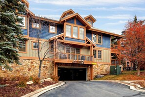 A large, multi-story building with a stone facade and wooden accents, featuring a prominent entrance and a sign above the doors. - Main Street - Just Steps Away | Private Hot Tub |Managed by Park City Lodging (Park City)