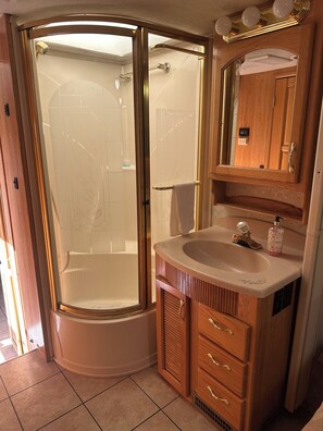 Shower, towels, soap, toilet paper