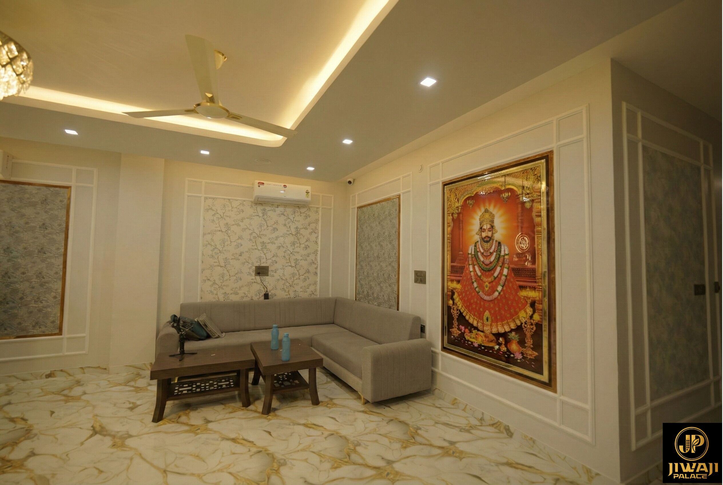 A living room with a sectional sofa, a coffee table, and a ceiling fan.