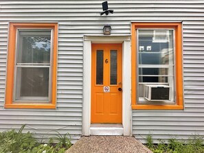 A house with a front door, two windows, and an air conditioning unit. - Large Backyard Oasis near River and Trails (Bridgewater)
