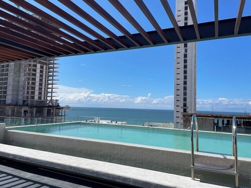 Stylish Brand New Family-sized Condo Steps to Beach & Malecón