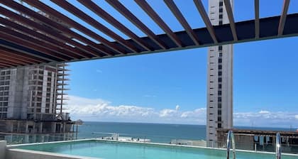 Stylish Brand New Family-sized Condo Steps to Beach & Malecón