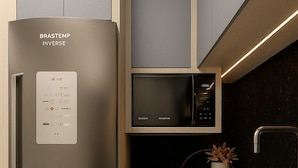A modern kitchen with a stainless steel refrigerator, a microwave, and a sink. - Pousada Mar do Sul (Itapema)