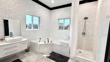 Jetted tub, hair dryer, towels, soap