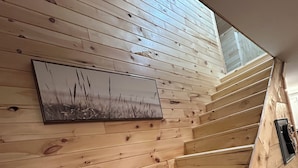 A wooden staircase with a view of the sky through a skylight. - Secluded Mountaineee -View Cabin with Hot Tub & Endless Country Sky (Elgin)