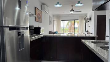 Fridge, microwave, stovetop, coffee/tea maker