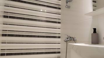 Deluxe Double Room, Balcony, City View | Bathroom | Shower, hair dryer, slippers, towels