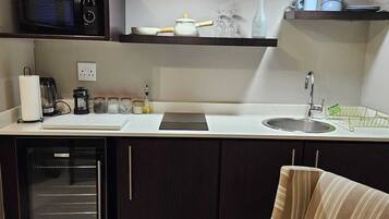 Fridge, microwave, stovetop, coffee/tea maker