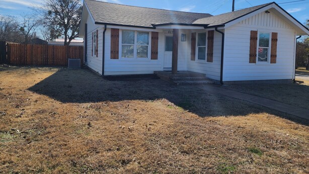 A small, single-story house with a gabled roof and a front porch. - Passing through/visiting family/doing business &need your own space? Stay Here! (Breckenridge)