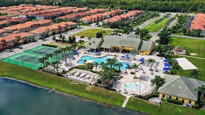 An aerial view of a resort with a swimming pool, tennis courts, and a water park. - Theatre & Games - Luxe Resort +10 Min Disney +pets (Kissimmee)