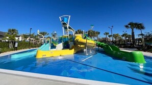 A water park with slides and a pool. - Champions Oasis - Resort&arcade -walk to Clubhouse (Davenport)