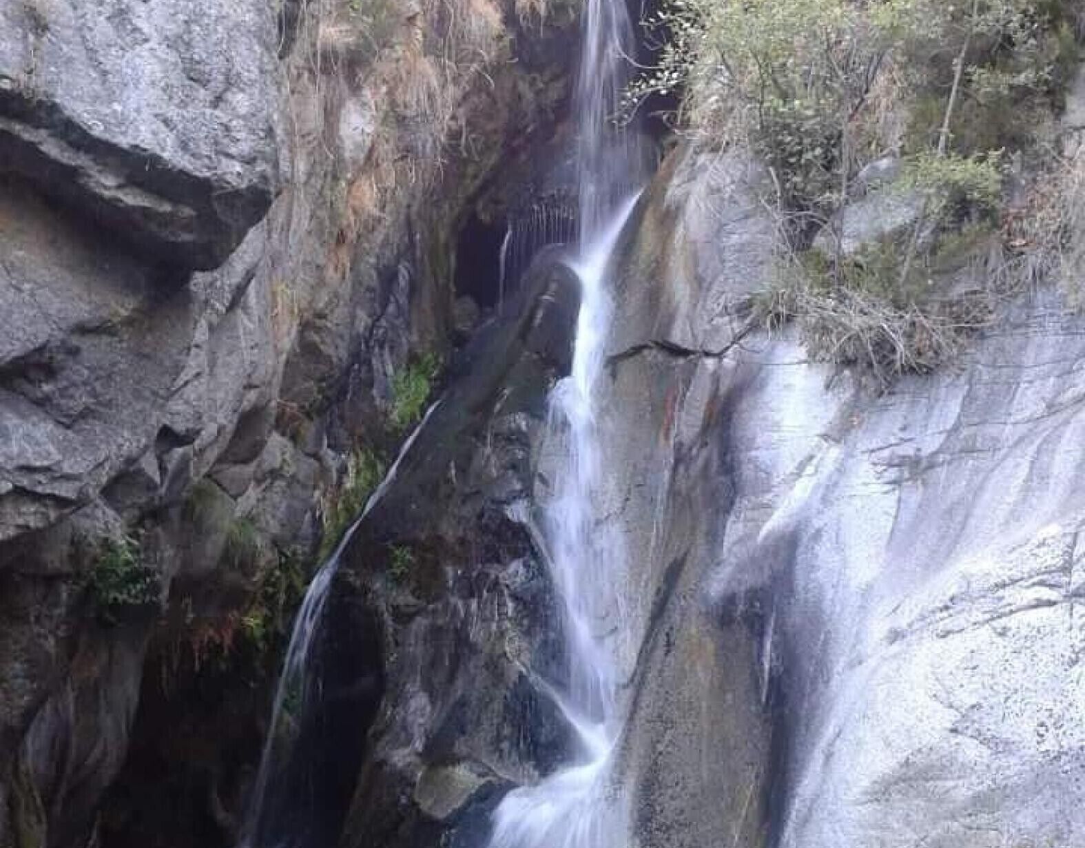 A waterfall cascading down a rocky cliff.