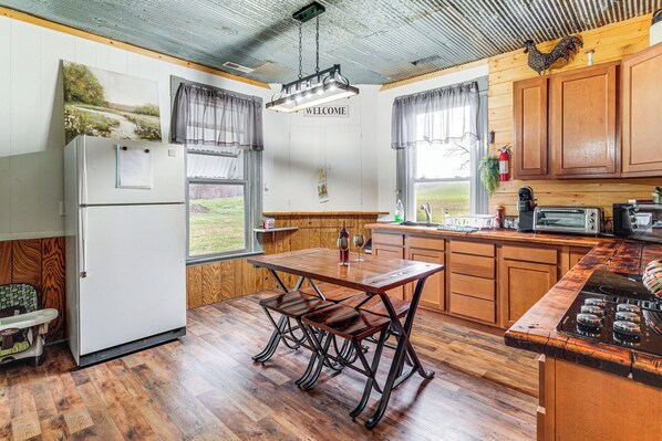 Fridge, microwave, stovetop, coffee/tea maker