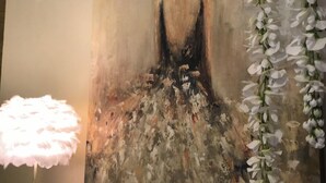 A painting with abstract forms and a textured surface. - Cozy Nature-Inspired Feather Room With King Bed, Alcove Nook (Bigfork)