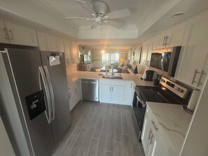 Fridge, microwave, oven, stovetop - Ground Level Condo on Golf Course Minutes to the Beach (Fort Myers)