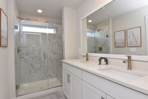 Shower, towels, soap, toilet paper