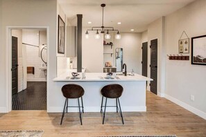 Shower, hair dryer, towels, soap - RALEIGH | Modern ADA-Accessible Studio (Denver)