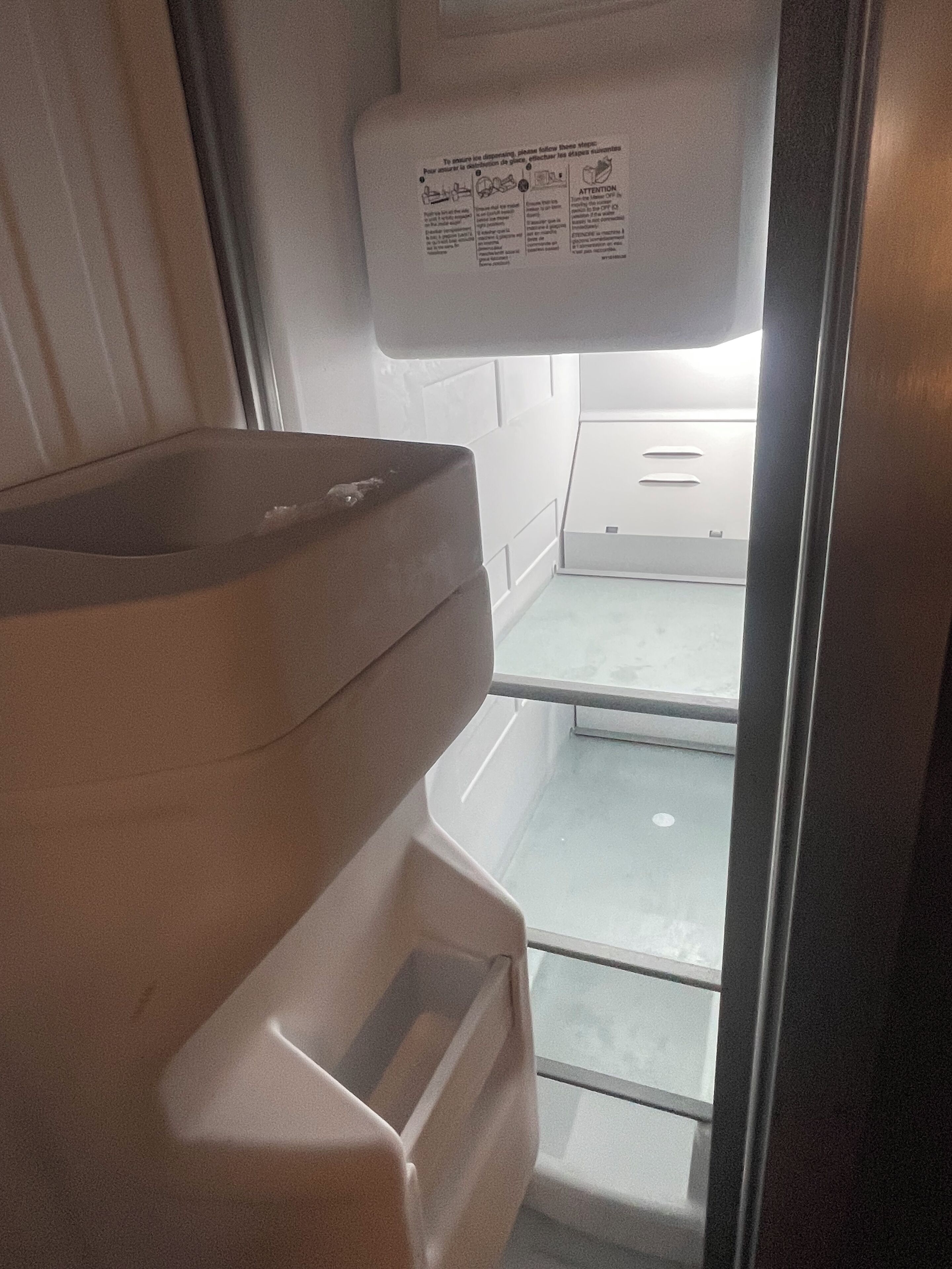 A bathroom with a toilet, a sink, and a window.