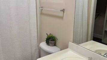 Shower, hair dryer, towels, shampoo