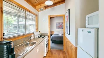 Cottage, 1 Bedroom, Patio | Private kitchen | Full-size fridge, microwave, stovetop, cookware/dishes/utensils