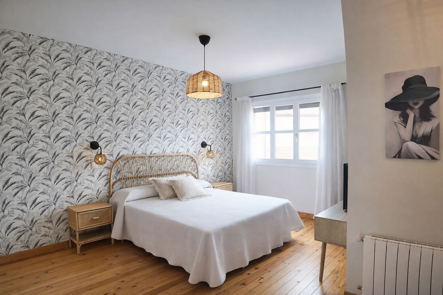A bedroom with a bed, a nightstand, a wall-mounted lamp, a window with curtains, and a radiator.