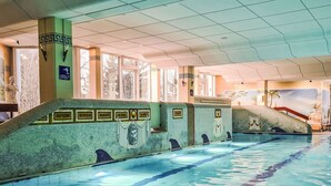 A swimming pool with tiled walls, a diving board, and a mural. - Nice apartment for 3 guests with WIFI, pool, TV, terrace and panoramic view (Sankt Englmar)