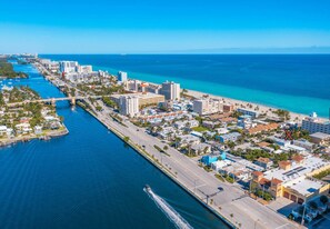 An aerial view of a coastal city with a marina, a bridge, and a beach. - Beach House on the Beach for 8 People With Jacuzzi (Hollywood)