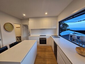 Private kitchen - Family-sized home with beautiful views of the ocean & the Otway forest. (Separation Creek)