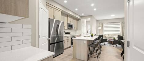 Coffee/tea maker, fridge, microwave, oven