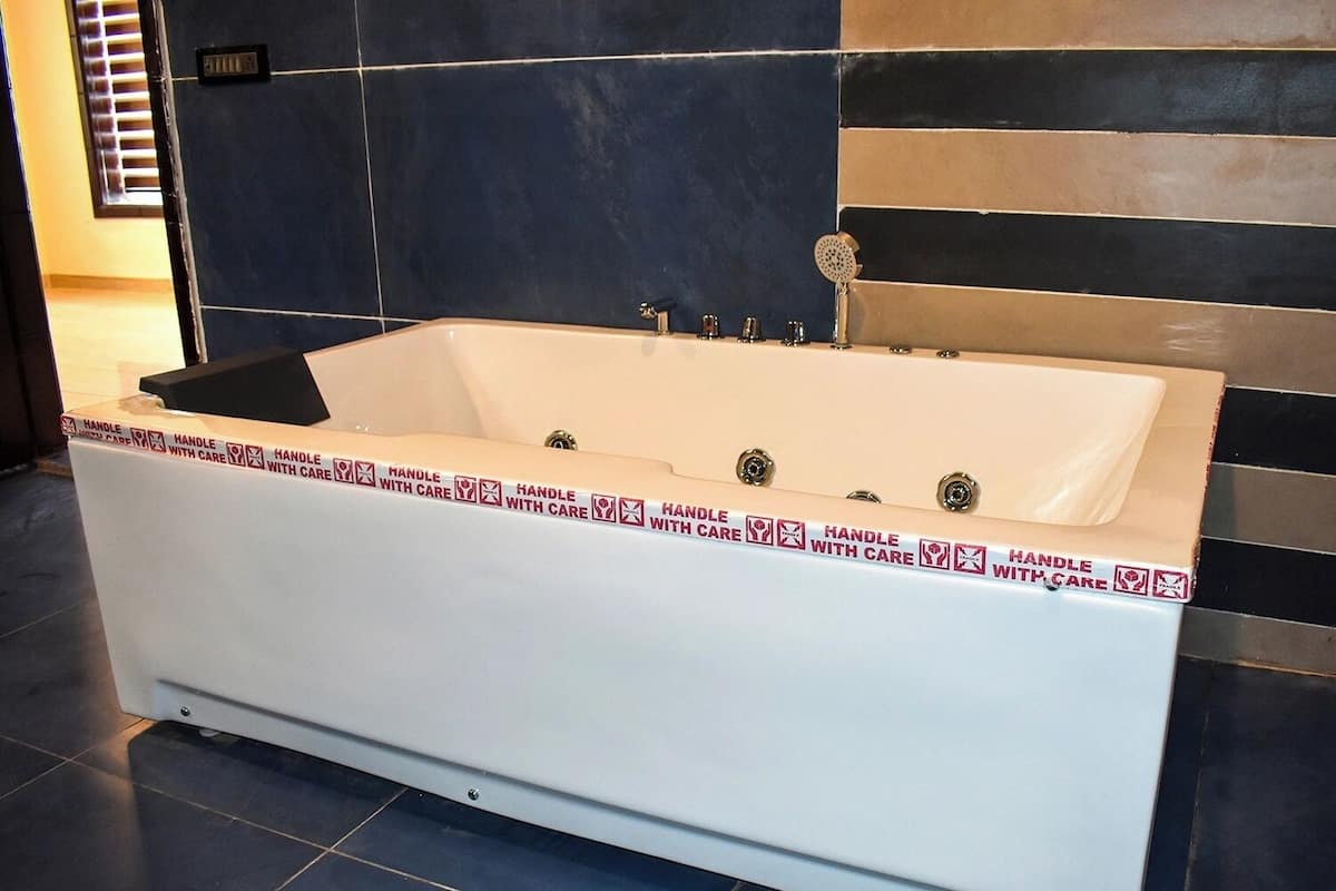 Premium Suite, Balcony, Garden View | Bathroom | Hair dryer, slippers, towels, soap