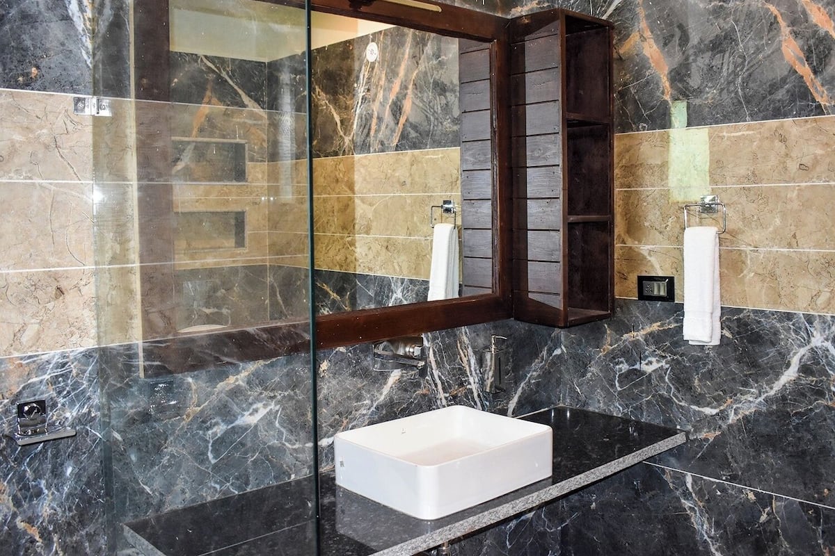 Family Cottage, Balcony, Garden View | Bathroom | Hair dryer, slippers, towels, soap