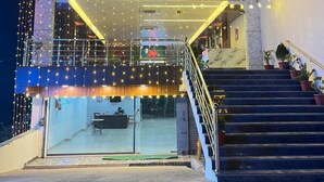 A building with a sign that reads "HOTEL ANANDAM RESTAURANT". - Anandam Hotel (Pindra)